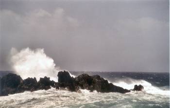 Wave breaking on lava rocks