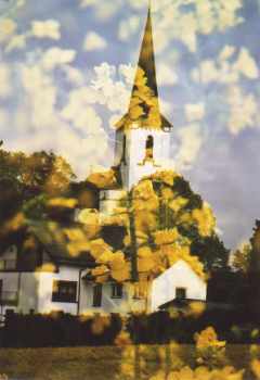 Eschweiler chuch double exposed with a field of rape